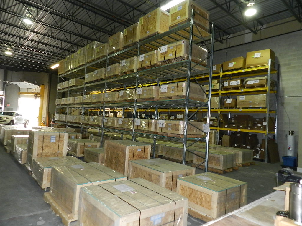 Warehouse storage area with palletized locomotive spare parts